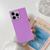 A girl holding Neon Lavender - iPhone Square Case beside a book