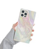 A girl holding Picasso Paint Splatter - Marble iPhone Case in her hand