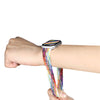 a hand wearing silver apple watch with colorful apple watch band